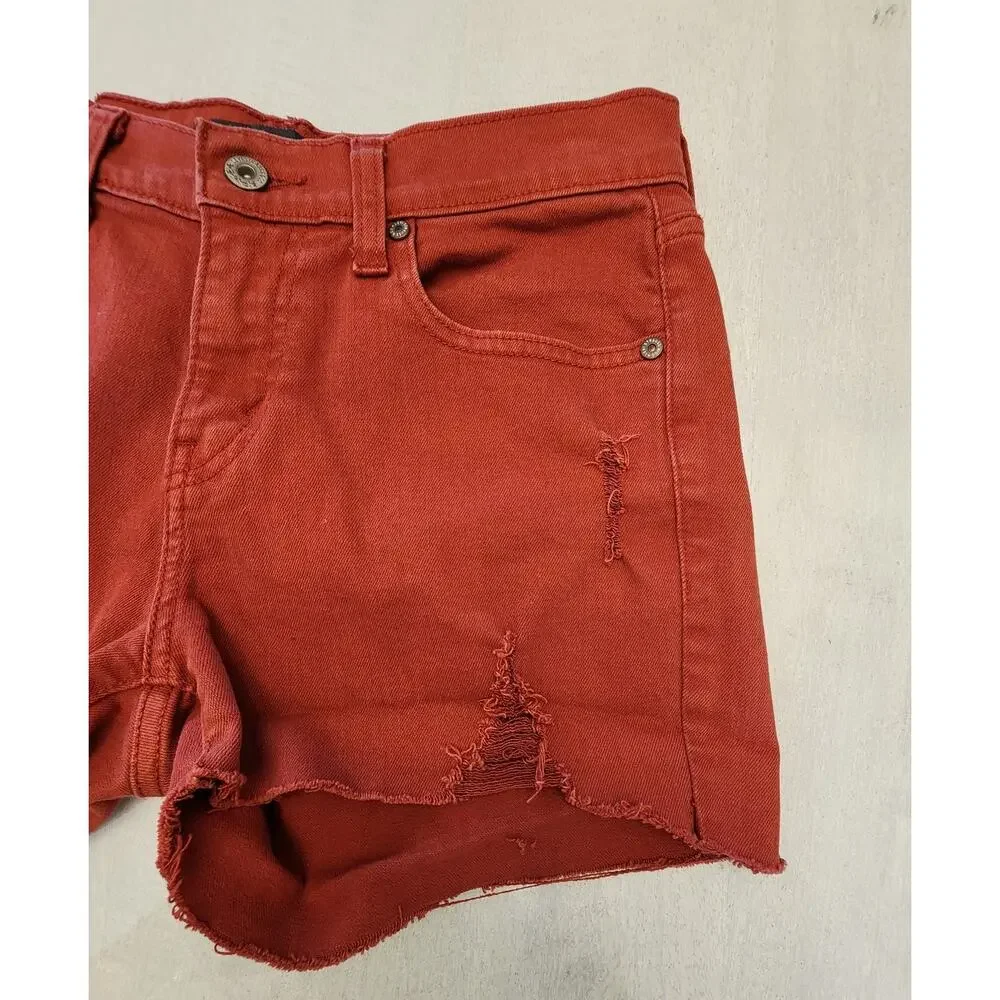 Levis Women's Cut off Denim Shorts SZ 4 Distressed Butterfly Patch Rust